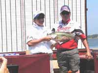 Tucker Adams (MO), 2003 Junior Bassmasters National Champion, 11-14 Age Group, with his 5.09 pound bass - July 19, 2003.  Photo: Courtesy of Charlie Beach