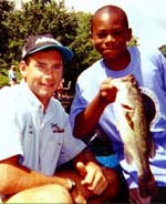 Boat captain John Gardner of Glastonbury, CT and Ramael Barton of Danbury, CT, who was 2nd place in the Big Fish category of Group A.  Ramael's bass weighed 2.39 pounds. - Friday, July 31, 1998