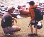 Boat captain Jordan Paullo from Vernon, CT and Casey Popke from Danbury preparing for the camp tournament - Friday, August 20, 1999
