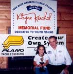 Ray Kerchal presenting a 2nd place trophy to Maria Contreras of Danbury, CT.  Maria caught 24 fish in Level I-B - Friday, August 18, 2000