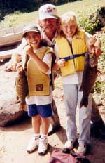 Boat captain Rick Wertheim from Bellingham, MA with Jonathan Contreras and Tanya Carlson of Danbury, CT.  Tanya caught the big fish of the week, a 4 pound - 9 ounce smallmouth bass. - Wednesday, August 16, 2000