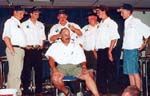 The 1st place New York State team shaving the head of Wayne Tomassi, NY Federation President.  Wayne and the NY Youth Director, Micky Fortunato Jr., vowed that if the team won the tournament, they would shave their heads - July 7, 2001