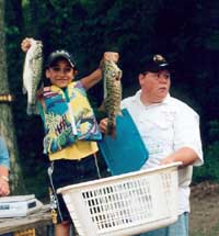 Andrew Fisher of Danbury, CT and Jim Morgan, weighmaster, of Highland, NY  Tournament Day, Friday, August 16, 2002