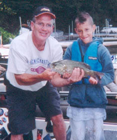 Boat Captain Bob Jeffrey and Mathew White of Greenwich, CT with Matts very first fish ever - Wednesday, August 17, 2005