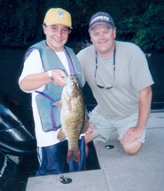 Zach Zeno (A-2 Group) of Southbury, CT with his 4.70 lb. bass (big fish of the week) and Boat Captain Art Rife  Thursday, August 17, 2006