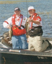 Payden Hibdon (left) with Nick Kelly from Brownsville, TN.  Kelly is the 2006 Junior Bassmaster World Champion in the 15-18 age bracket.   February 19, 2006 – Harris Chain of Lakes – Leesburg, FL